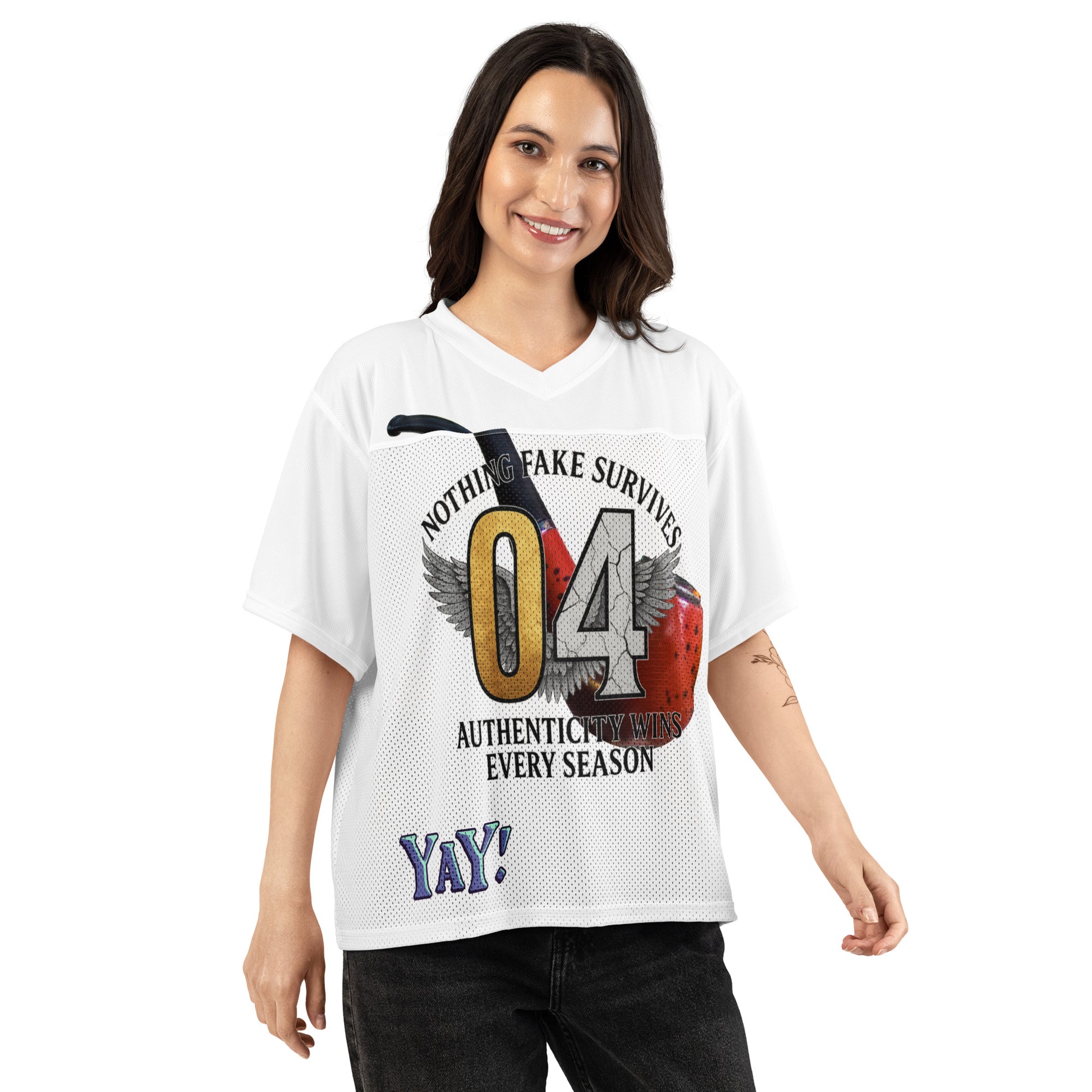 Woman wearing a white NFS t-shirt with a graphic design 