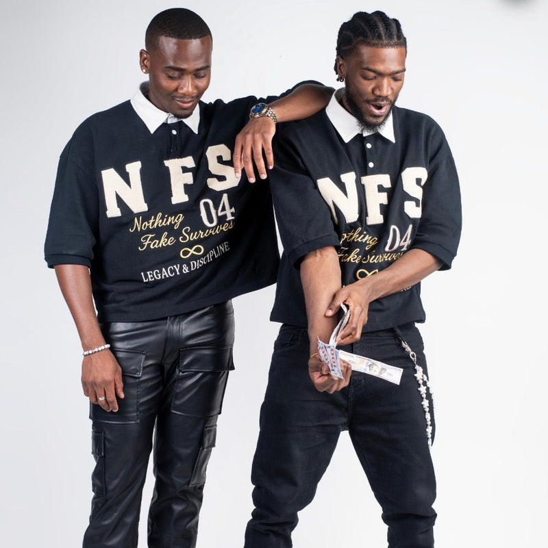 Two men wearing matching black polo shirts with 'NFS' branding on a white background.