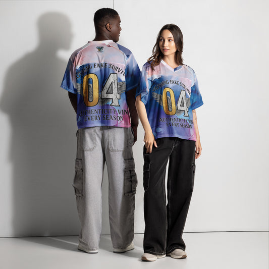 Two people wearing matching colorful jerseys with text and numbers on a plain background